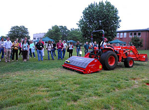 Vertiquake Demonstration The Vertiquake machine rolls over an area of poor turf quality, and demonstrates how the use of ground penetrating blades, the soil can be amended while barely disturbing the surface. Photo courtesy of <a href="http://njaes.rutgers.edu/spotlight/soil-health.asp" target="_blank">Rutgers University</a>.